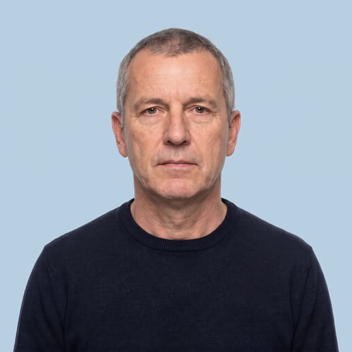 Identity photo against a pale blue background