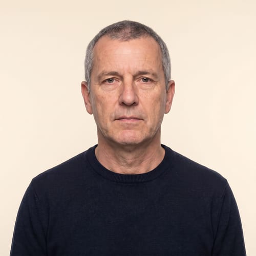Identity photo against an off-white cream background