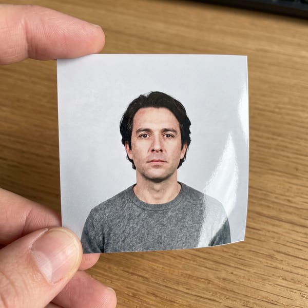 A photograph of a printed photo held in someone's hand